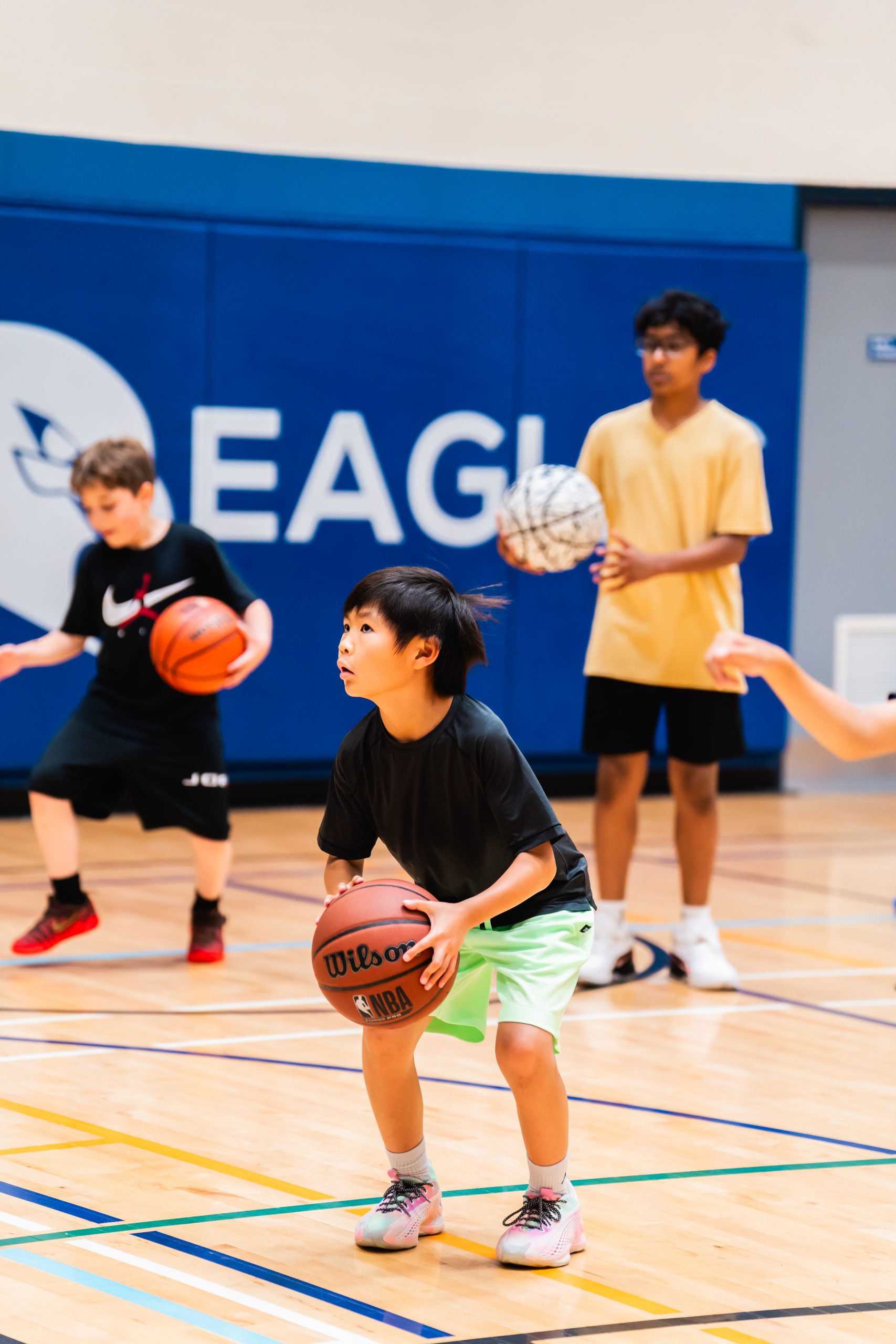 Player in a defensive dribbling stance at Elite Skills Lab