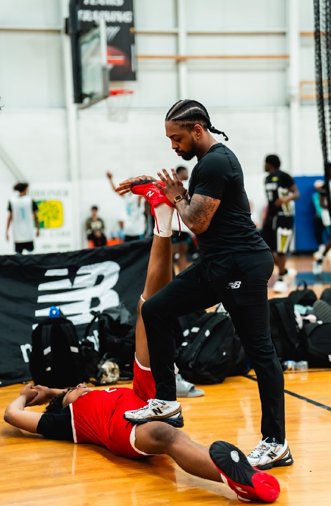 Coach Anthony Meggo training a young athlete